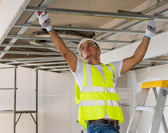 Man working wearing protection gear
